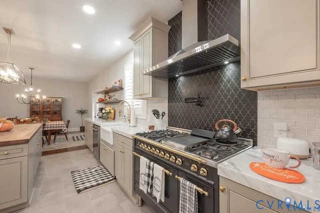 a kitchen with a stove and a white wooden cabinets