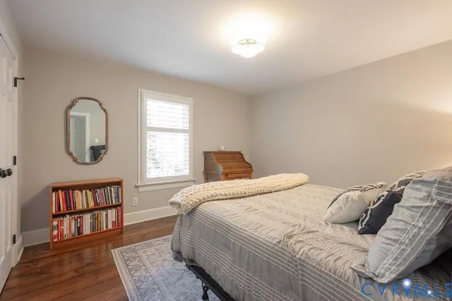 a bedroom with a bed furniture and a window