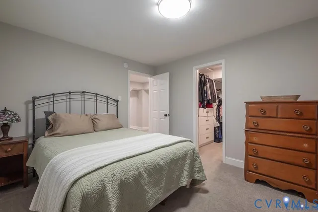 a bedroom with a bed and a closet