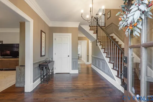 a view of entryway and hall with wooden floor