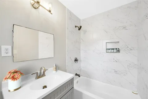 a bathroom with a sink and a bathtub