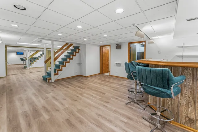 a view of an entryway with wooden floor