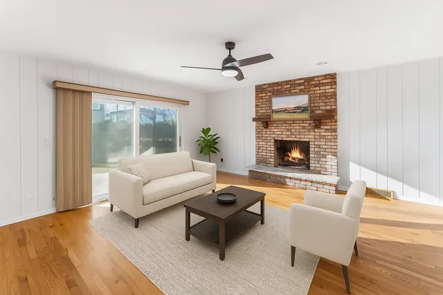 a living room with furniture and a fireplace
