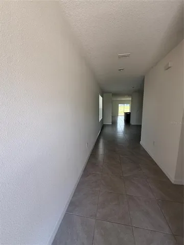 a view of hallway with windows
