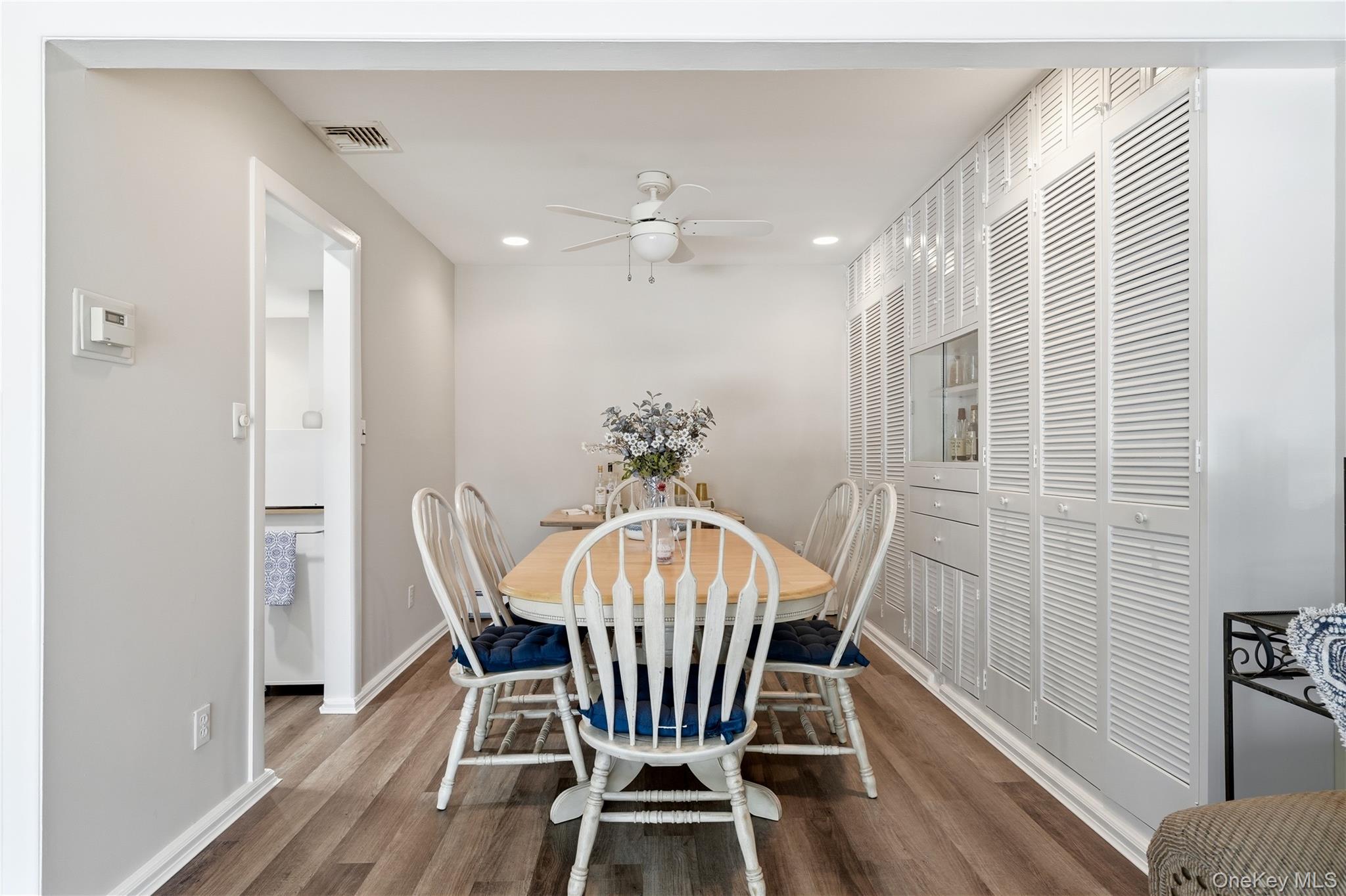 1853 Decatur Avenue Merrick, NY 11566 - Photo 9 of 43 a view of a dining room with furniture window and wooden floor