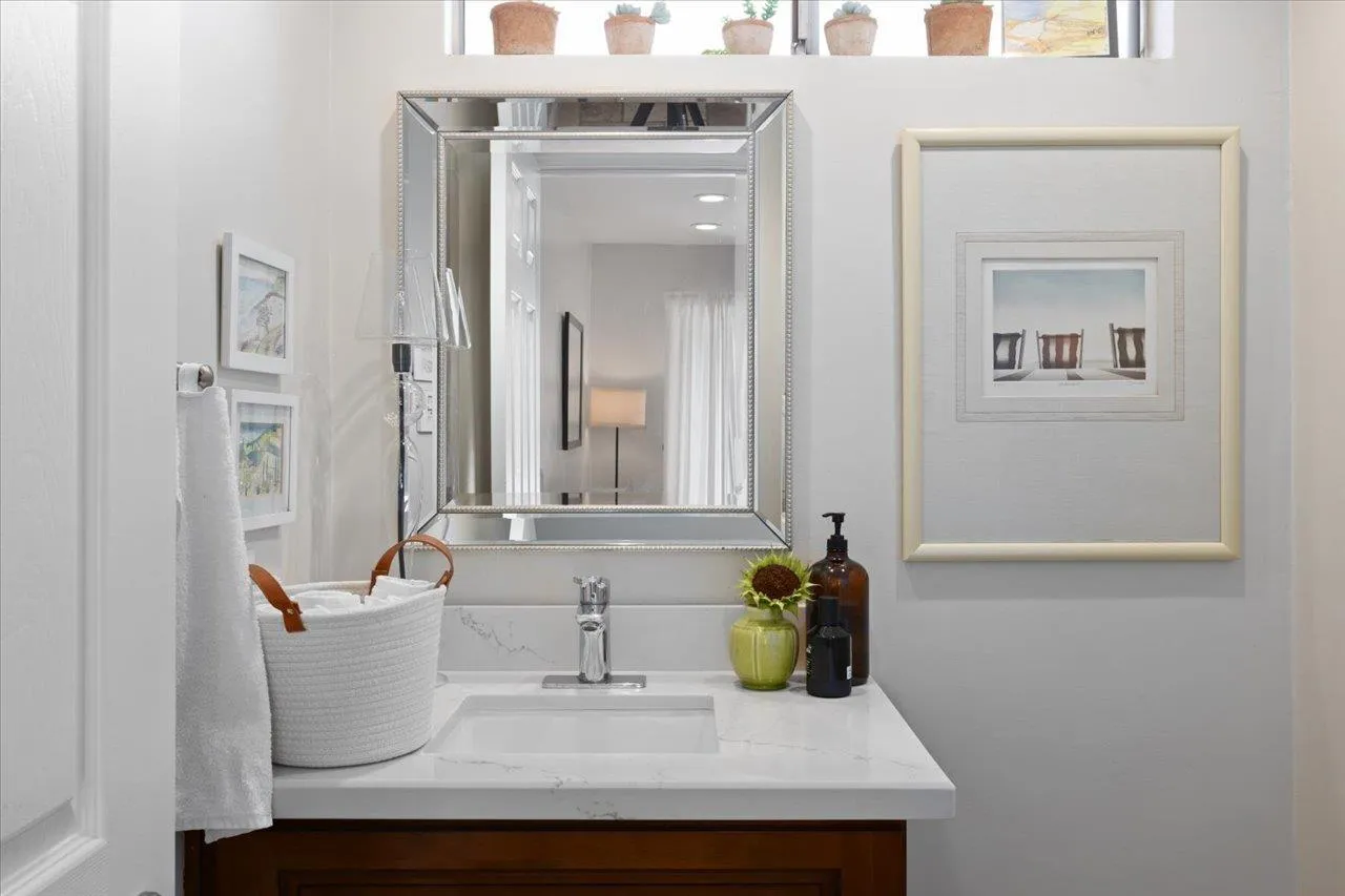 1763 Edgefield Lane Encinitas, CA 92024 - Photo 16 of 31 a bathroom with a sink and a mirror
