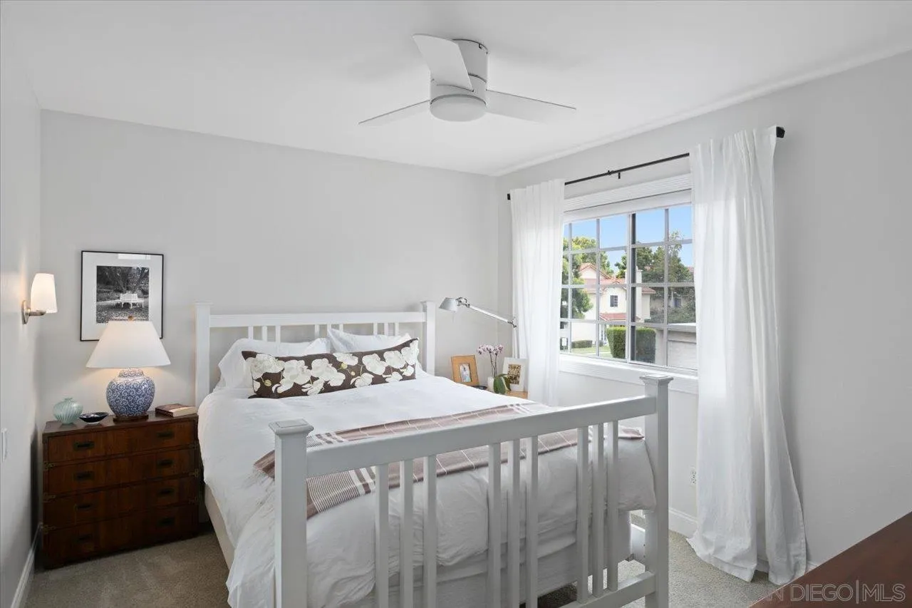 1763 Edgefield Lane Encinitas, CA 92024 - Photo 22 of 31 a bedroom with a bed and wooden floor