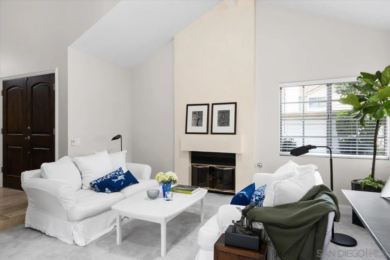 1763 Edgefield Lane Encinitas, CA 92024 - Photo 4 of 31 a living room with furniture fireplace and a large window