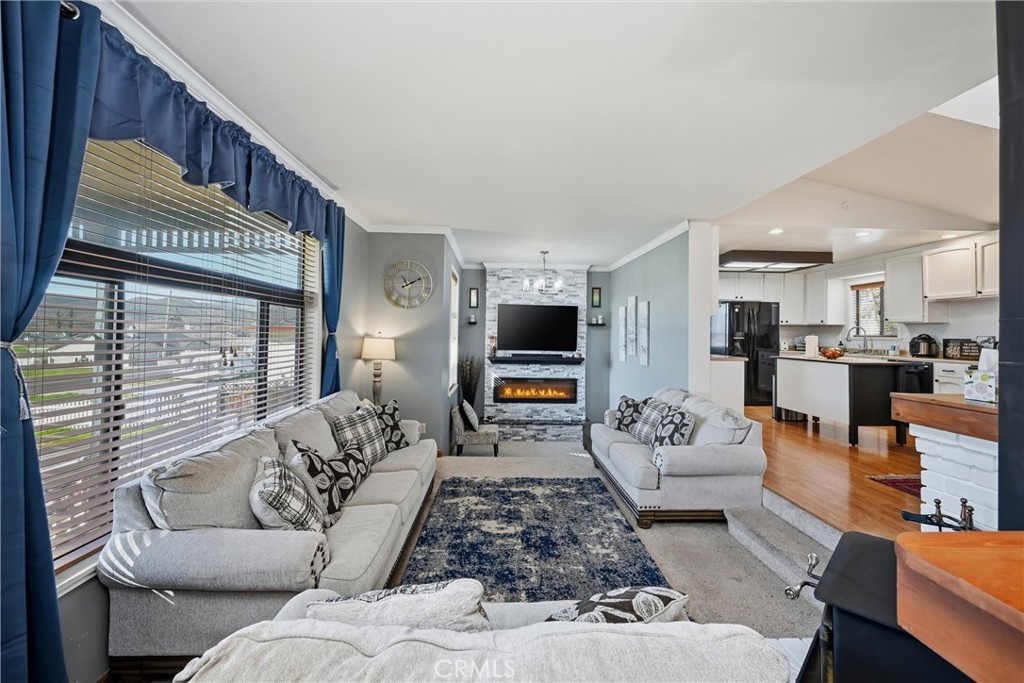 18712 Hidden Valley Road Hidden Valley Lake, CA 95467 - Photo 11 of 38 a living room with furniture and a flat screen tv