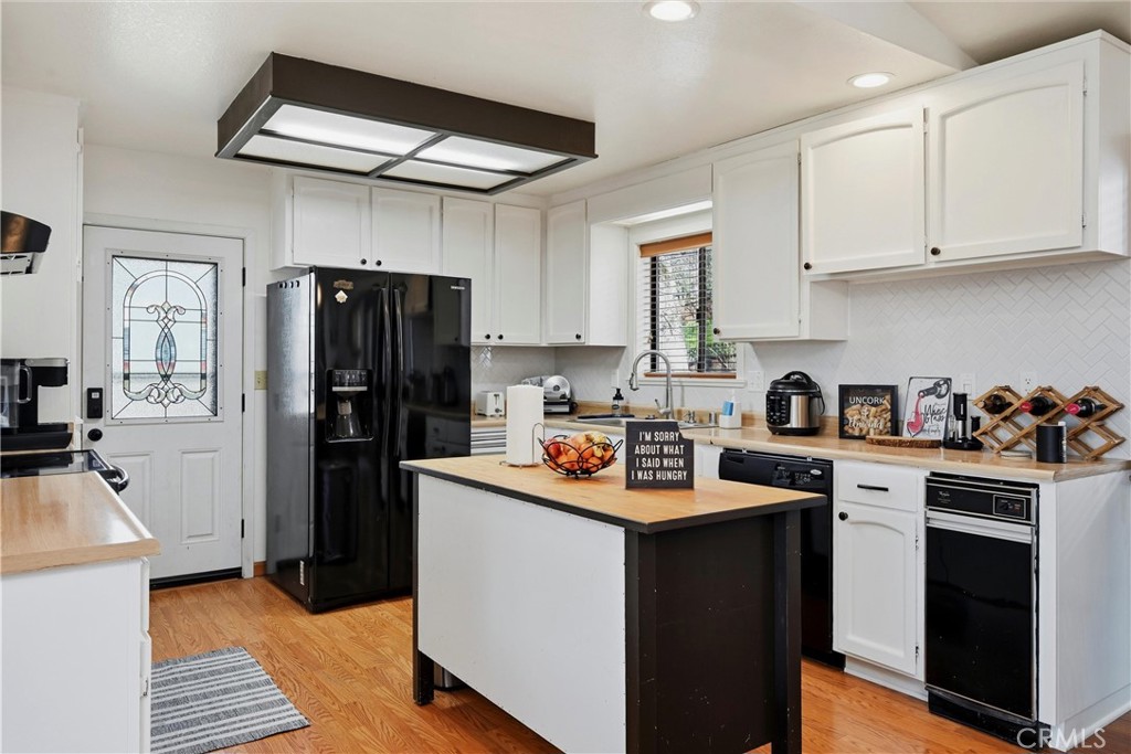 18712 Hidden Valley Road Hidden Valley Lake, CA 95467 - Photo 14 of 38 a kitchen with a sink stove and refrigerator