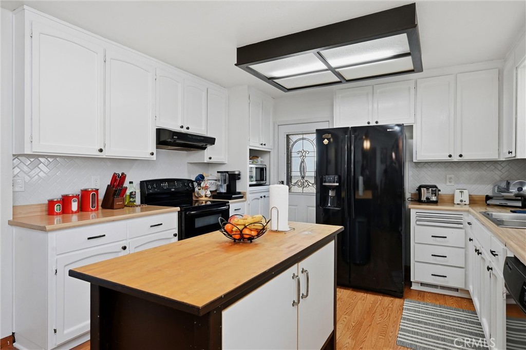 18712 Hidden Valley Road Hidden Valley Lake, CA 95467 - Photo 15 of 38 a kitchen with stainless steel appliances a stove refrigerator sink and cabinets