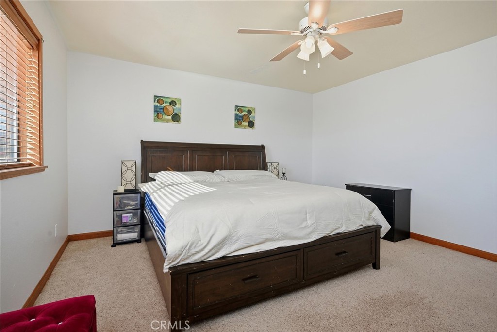 18712 Hidden Valley Road Hidden Valley Lake, CA 95467 - Photo 17 of 38 a bed sitting in a bedroom next to a window