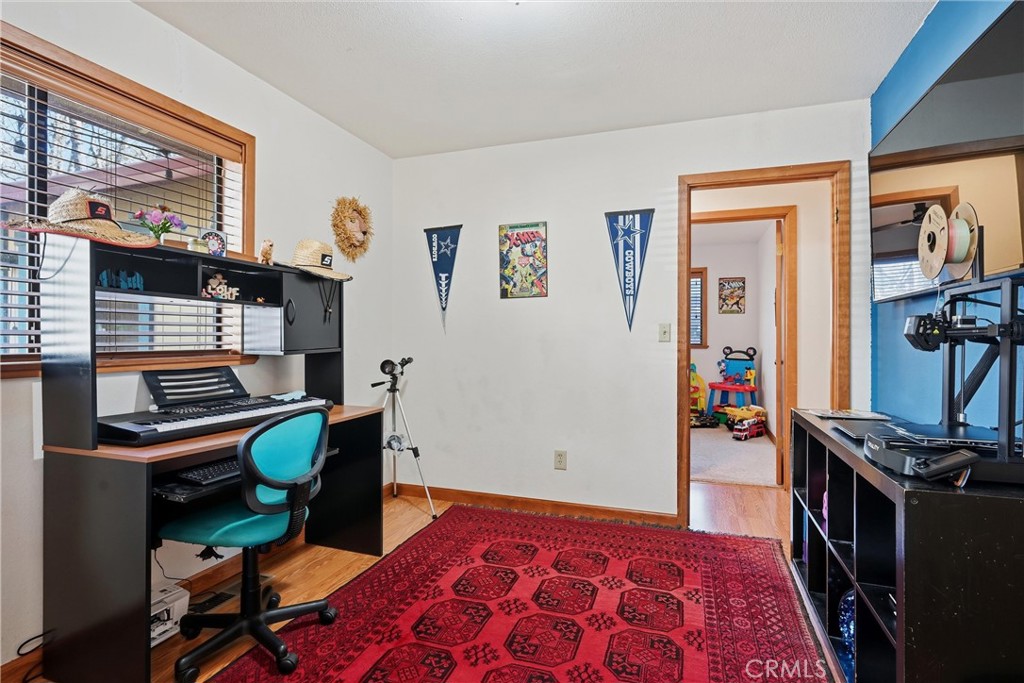 18712 Hidden Valley Road Hidden Valley Lake, CA 95467 - Photo 24 of 38 a bedroom with furniture and a window