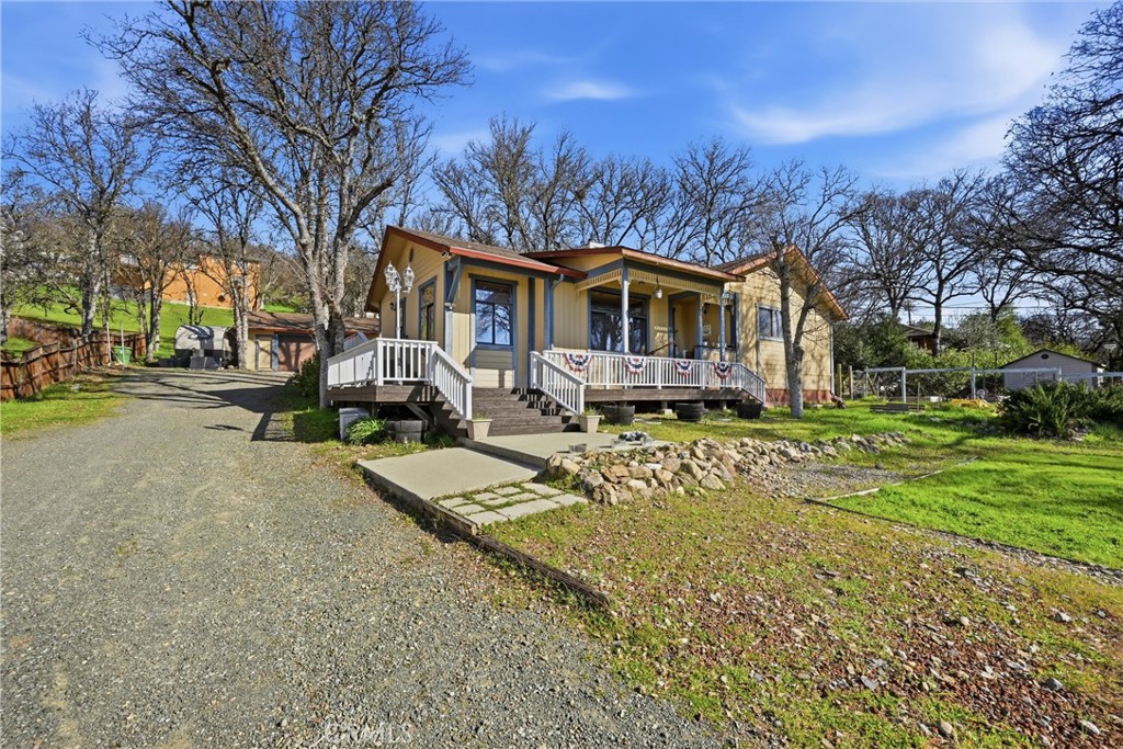 18712 Hidden Valley Road Hidden Valley Lake, CA 95467 - Photo 34 of 38 a front view of a house with a yard and trees