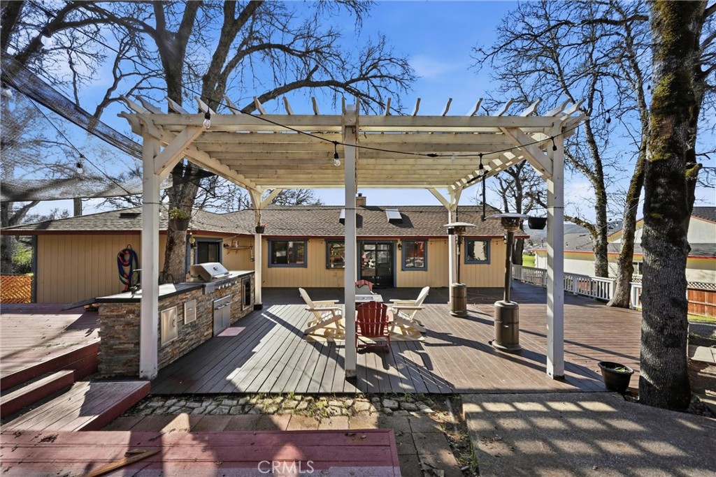 18712 Hidden Valley Road Hidden Valley Lake, CA 95467 - Photo 7 of 38 a view of a patio with table and chairs a barbeque with stove and floor