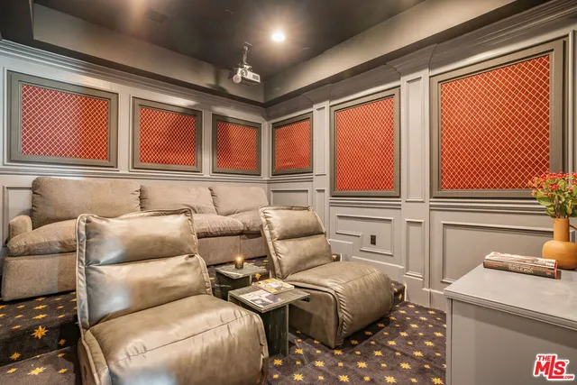 a bedroom with furniture and a large window