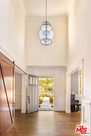 a view of a room with wooden floor and windows