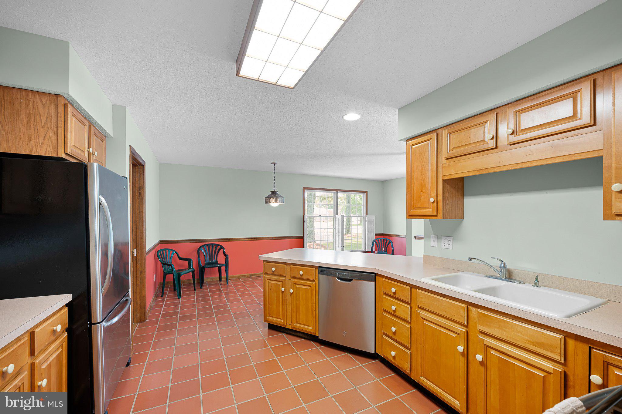 485 Bethany Loop Bethany Beach, DE 19930 - Photo 11 of 40 a large kitchen with stainless steel appliances granite countertop a sink and cabinets