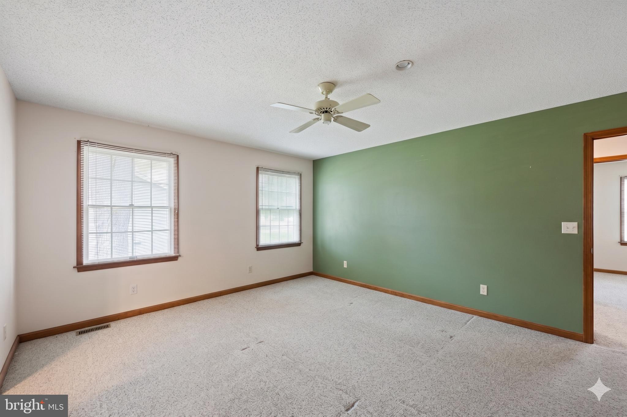 485 Bethany Loop Bethany Beach, DE 19930 - Photo 20 of 40 an empty room with windows and fan