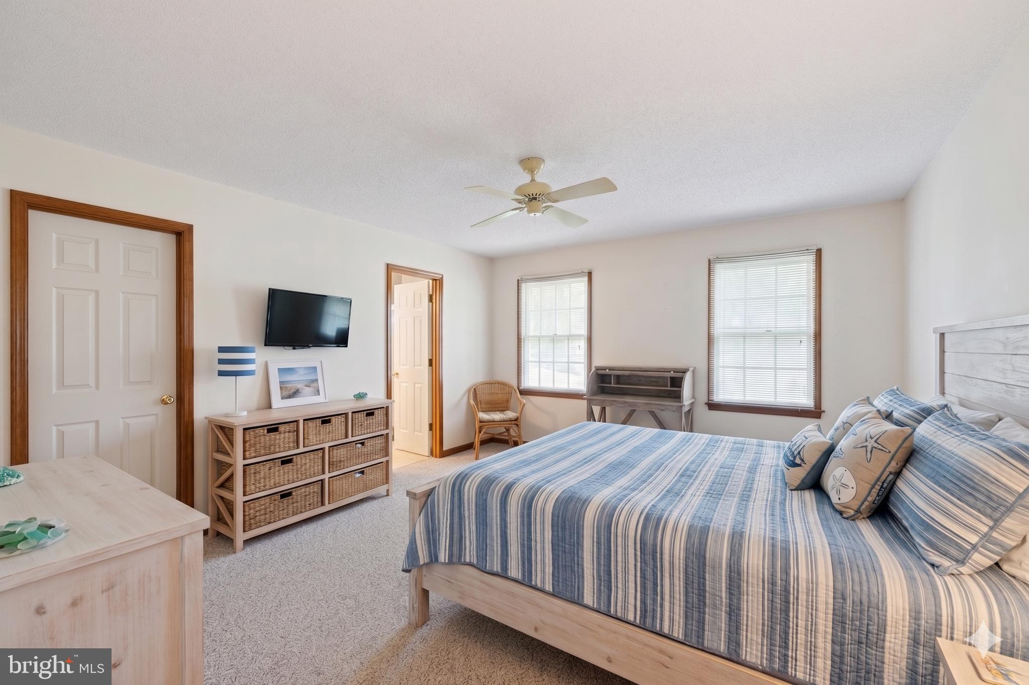 485 Bethany Loop Bethany Beach, DE 19930 - Photo 22 of 40 a bedroom with a bed and a flat screen tv