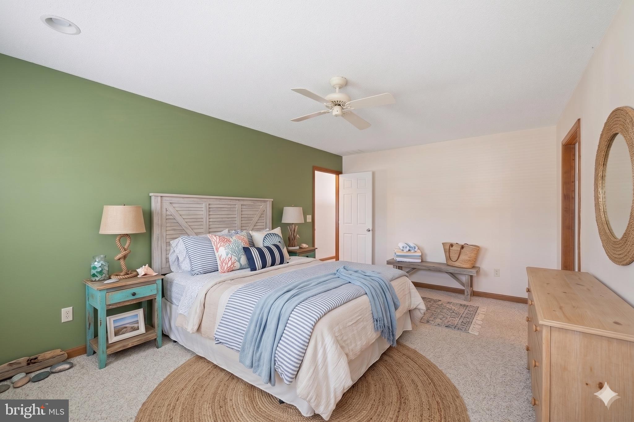 485 Bethany Loop Bethany Beach, DE 19930 - Photo 24 of 40 a bedroom with a bed and a chandelier