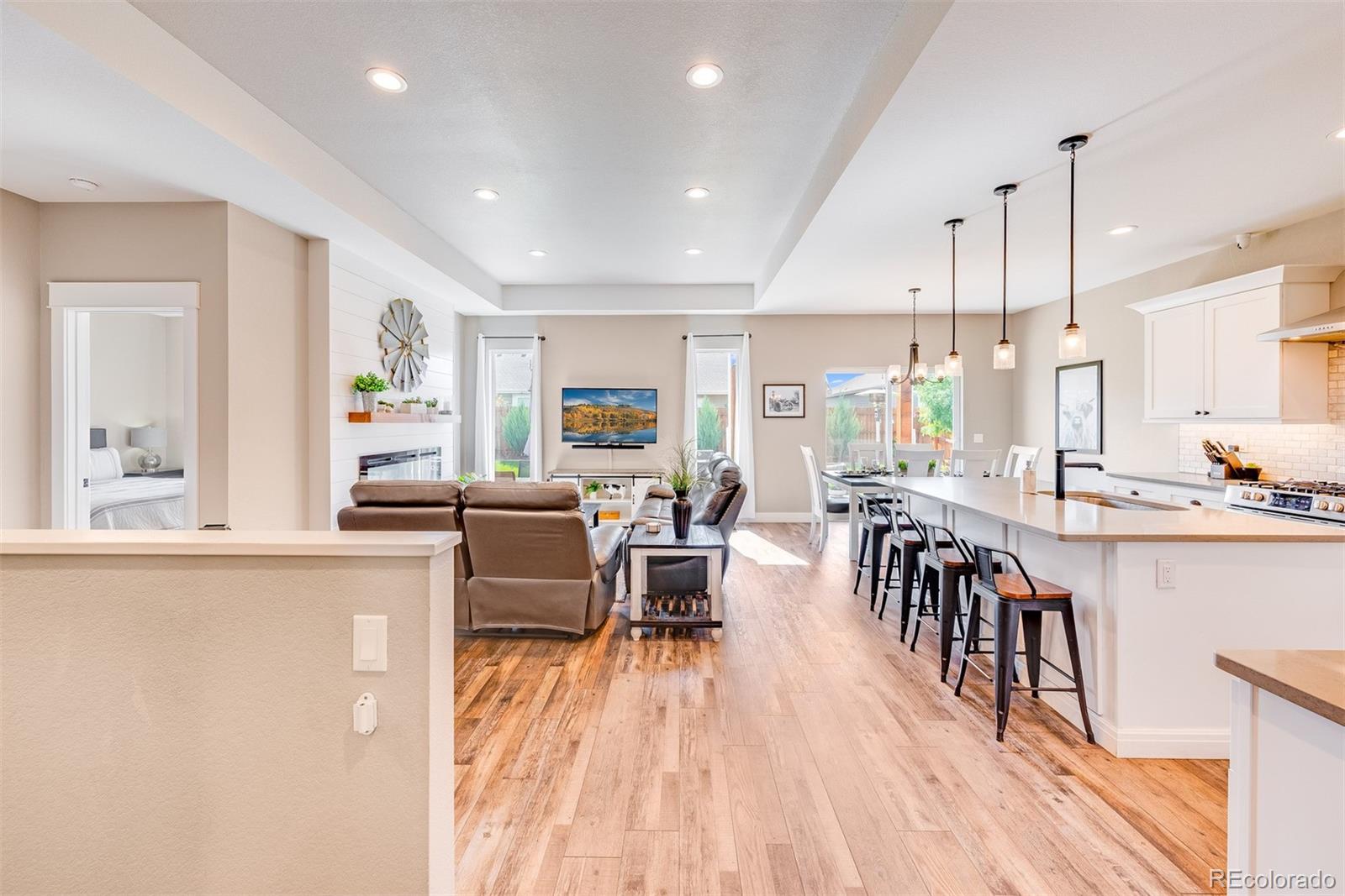 1122 Johnson Street Wiggins, CO 80654 - Photo 20 of 37 a view of a kitchen and dining room