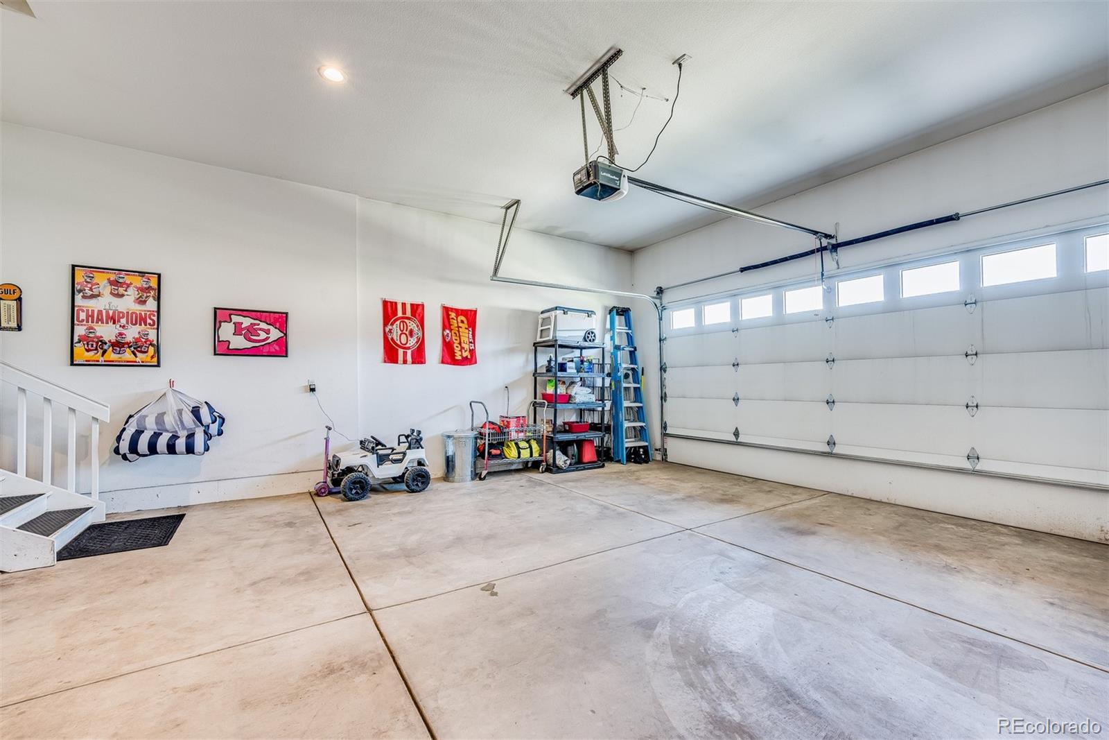 1122 Johnson Street Wiggins, CO 80654 - Photo 8 of 37 a view of a garage with storage