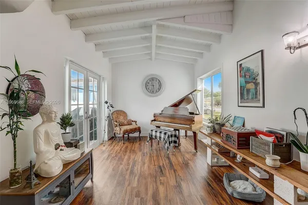 a room with furniture and wooden floor