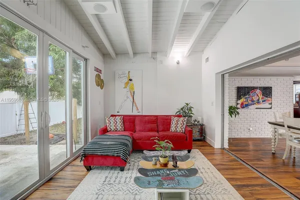 a living room with furniture and a rug