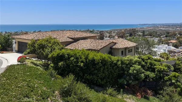 an aerial view of a house with a garden