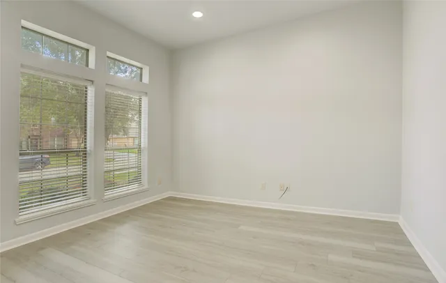 a view of an empty room with a chandelier