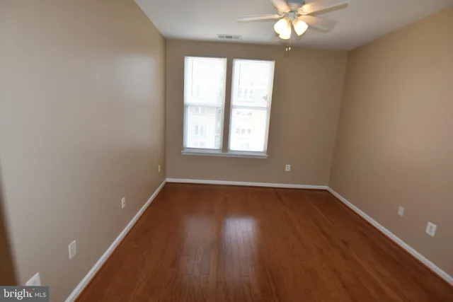 a bathroom with a toilet a sink and a mirror