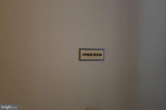 a room with pool table and a chandelier