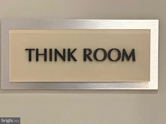a view of a patio with table and chairs and potted plants