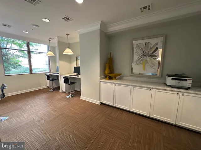 a view of a patio with couches chairs potted plants and floor to ceiling window