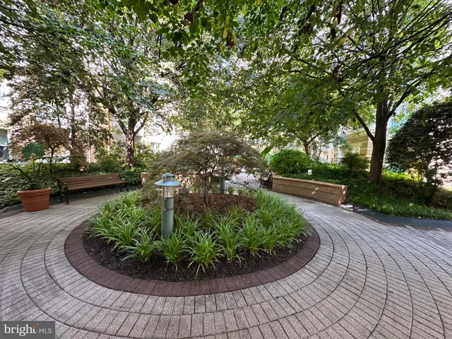 a view of a backyard with sitting area
