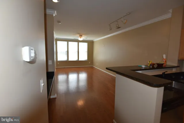 a view of a kitchen with a sink and a stove top oven