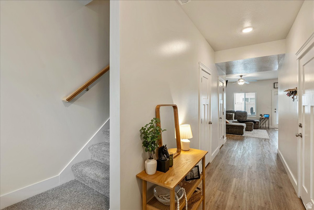 287 North 100th West Morgan, UT 84050 - Photo 5 of 27 Hallway featuring stairs and light wood finished floors