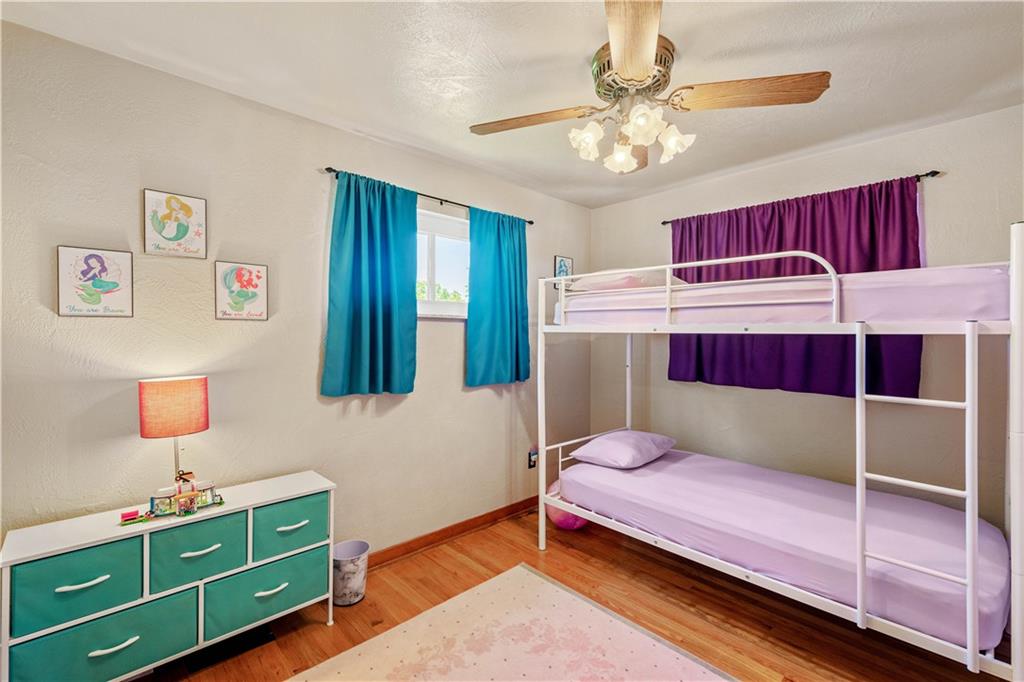 1230 Round Top Street Pittsburgh, PA 15205 - Photo 11 of 28 a bedroom with a bed and a chandelier