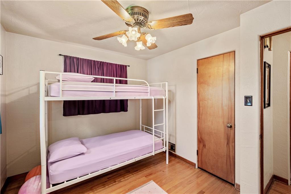 1230 Round Top Street Pittsburgh, PA 15205 - Photo 12 of 28 a bedroom with furniture and a chandelier