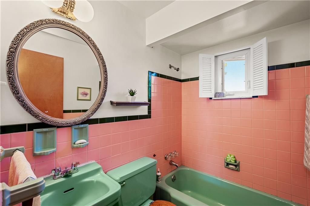 1230 Round Top Street Pittsburgh, PA 15205 - Photo 14 of 28 a bathroom with a sink mirror and toilet