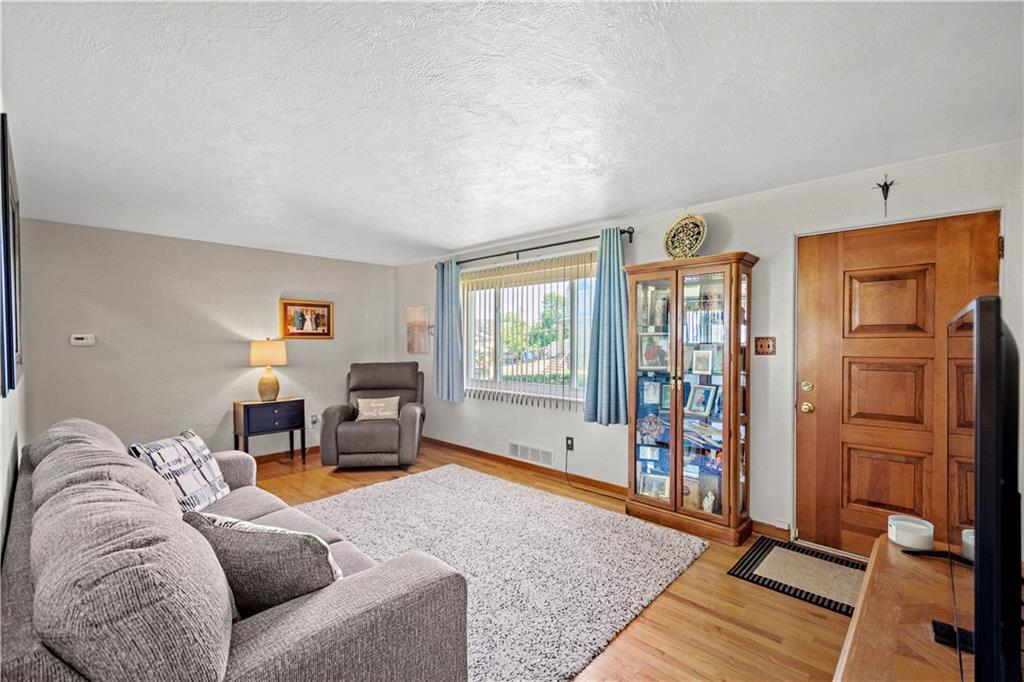 1230 Round Top Street Pittsburgh, PA 15205 - Photo 4 of 28 a living room with furniture gym equipment and a window
