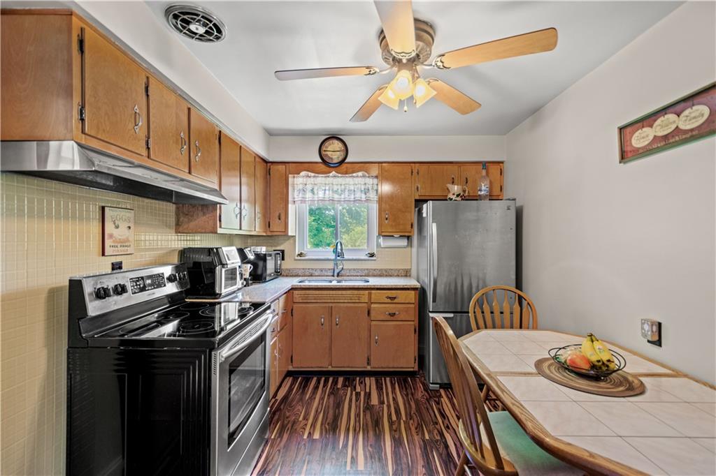 1230 Round Top Street Pittsburgh, PA 15205 - Photo 7 of 28 a kitchen with a sink appliances and cabinets