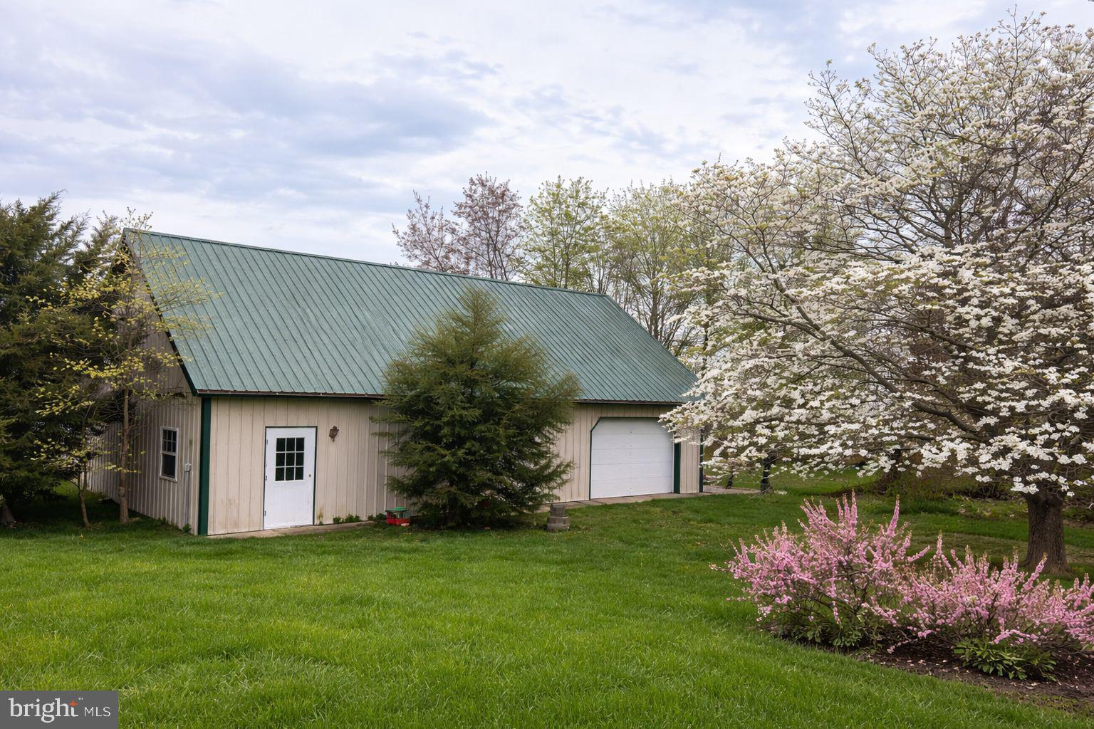 24295 Langford Road Chestertown, MD 21620 - Photo 3 of 3 a front view of house with garden