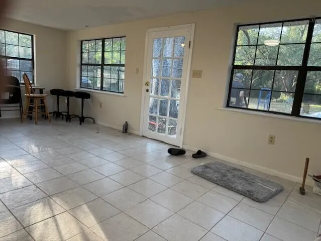 a bedroom with furniture and a window