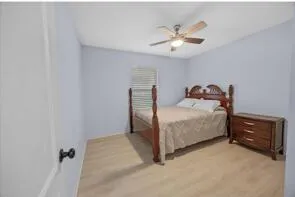 a bathroom with a toilet sink and shower