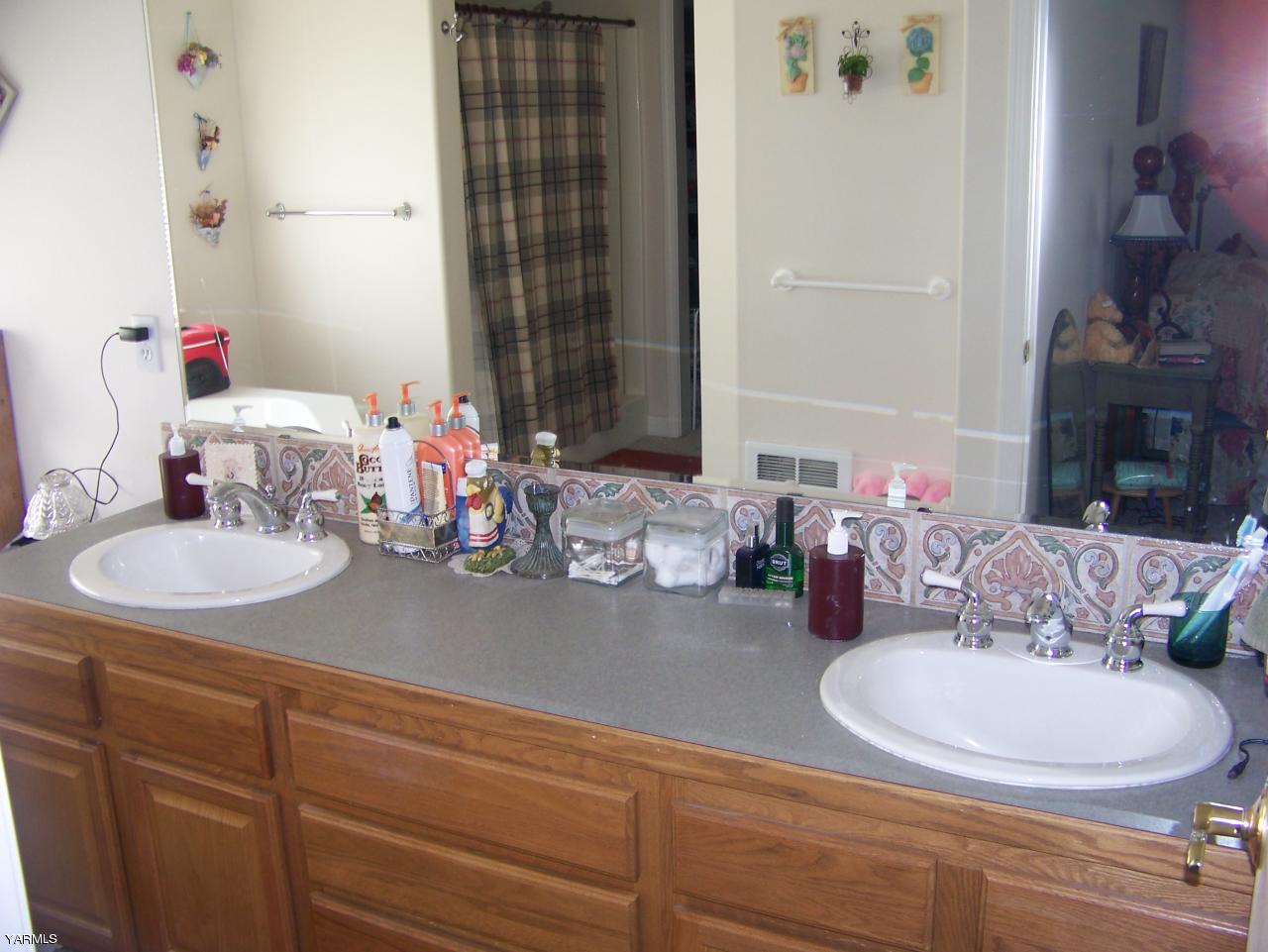 10811 Zier Road Yakima, WA 98908 - Photo 13 of 20 a bathroom with a sink double vanity and a mirror
