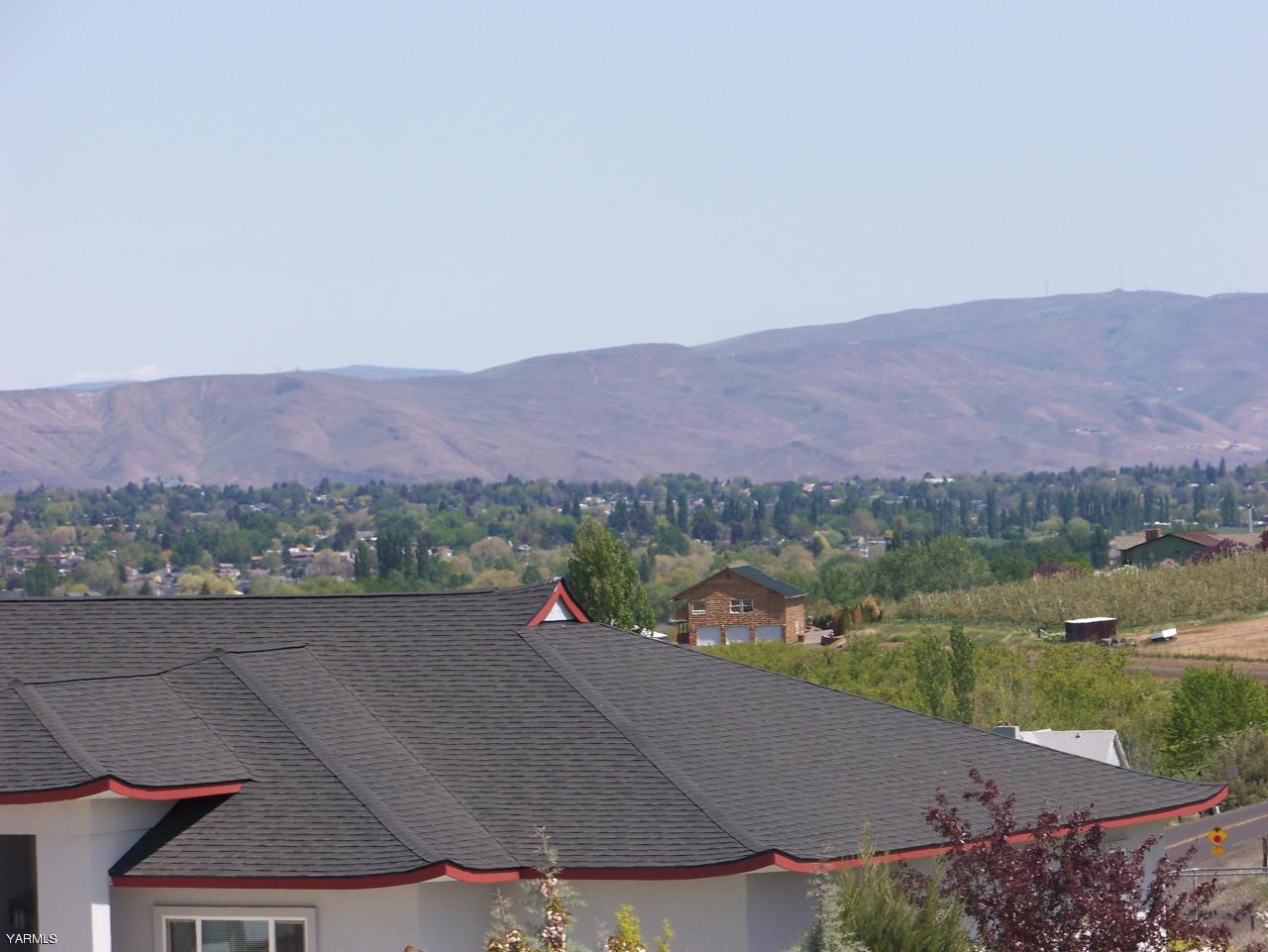 10811 Zier Road Yakima, WA 98908 - Photo 18 of 20 an aerial view of a house with a garden and a lake view