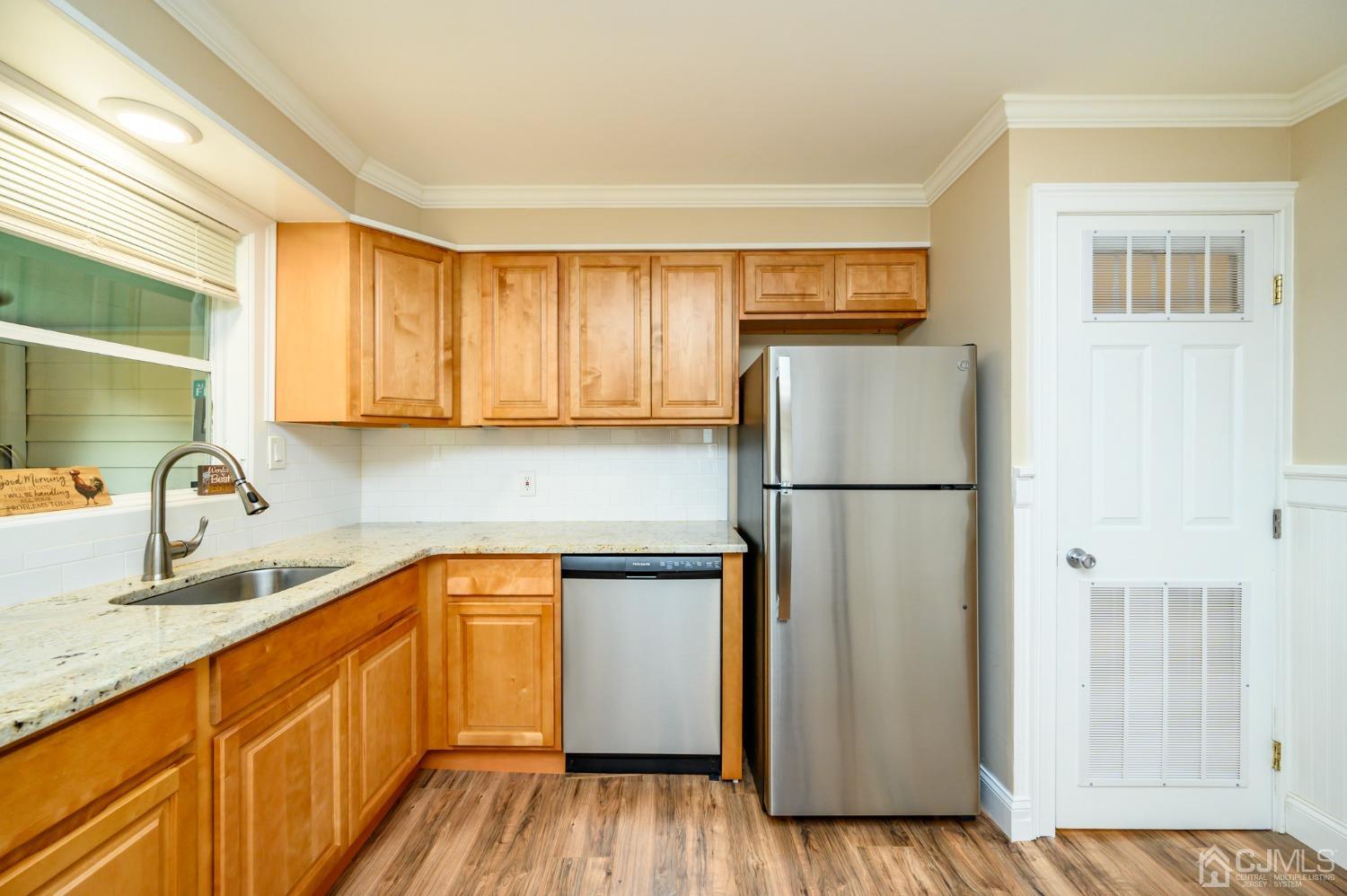 217 Clamer Road Ewing, NJ 08628 - Photo 11 of 29 a kitchen with a refrigerator sink and cabinets