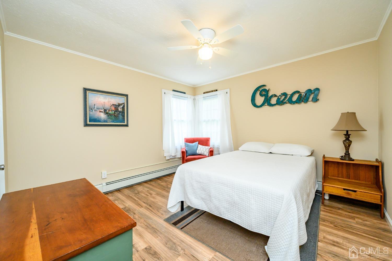 217 Clamer Road Ewing, NJ 08628 - Photo 16 of 29 a bedroom with a bed and a chandelier